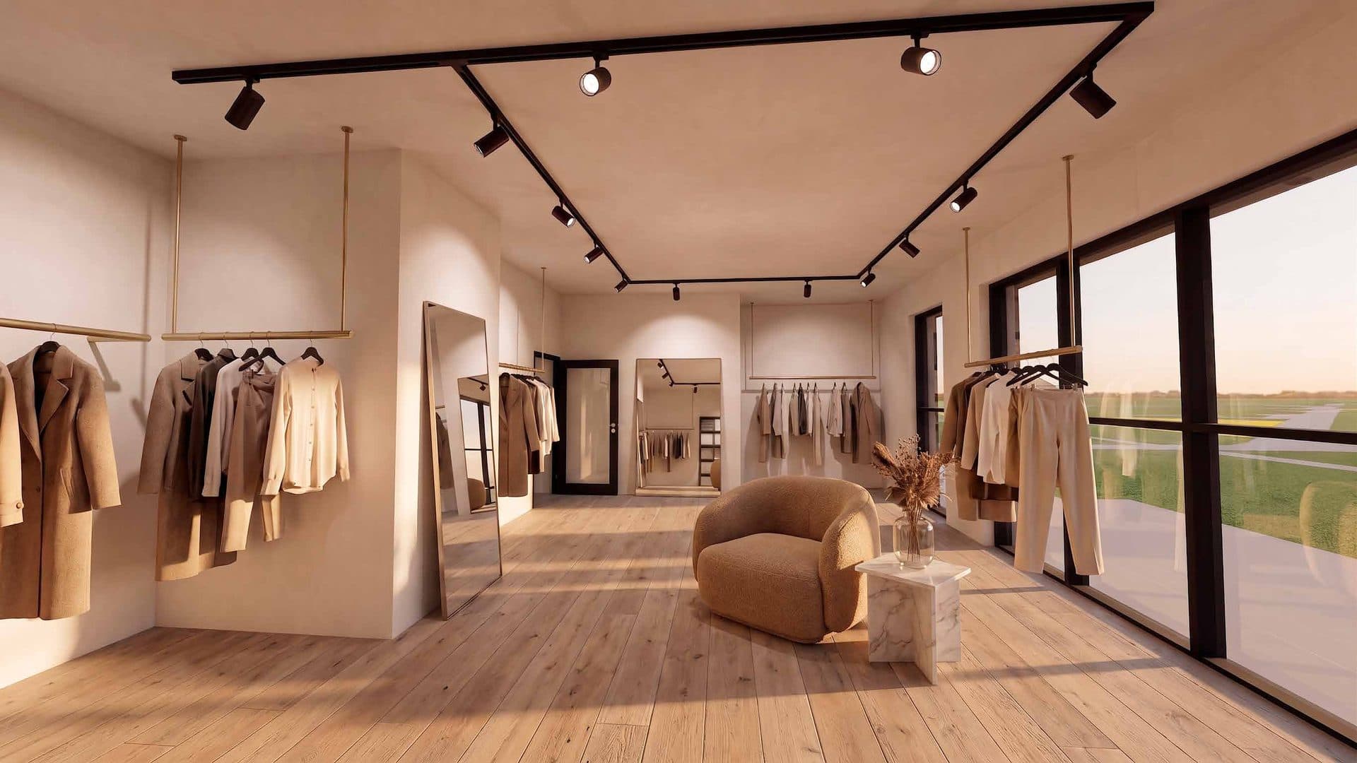 XXL-unit ingericht als boutique met kledingrekken, spiegels en een loungehoek
